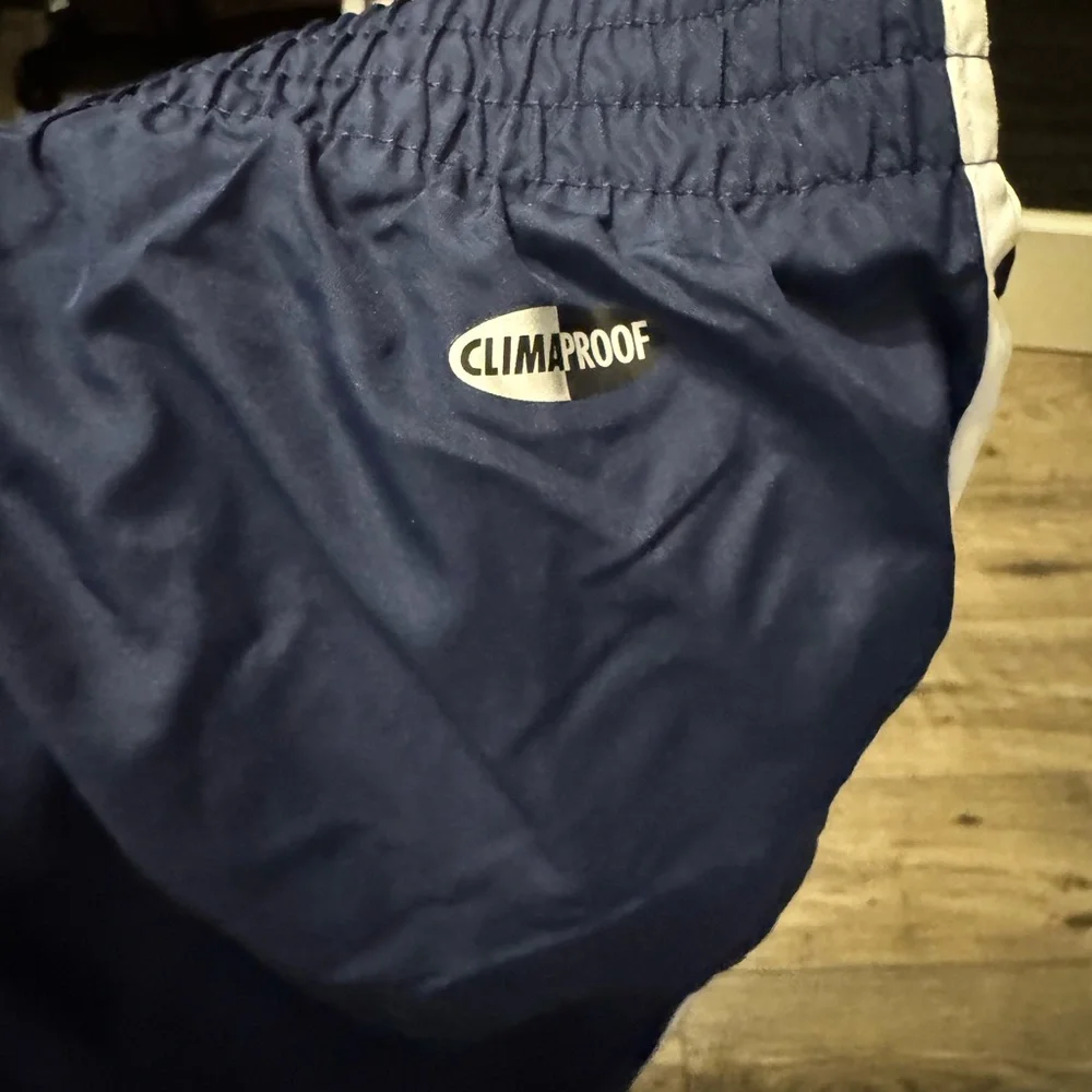 Adidas Navy Sweatpants with White Stripes and Elastic Waistband